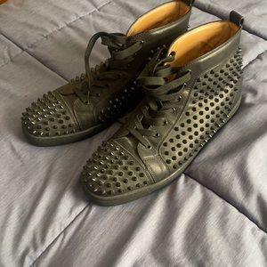 Black louboutin spike shoes. Red bottoms size 12.